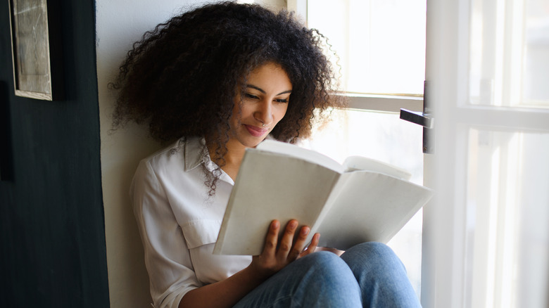 Young woman holding a book