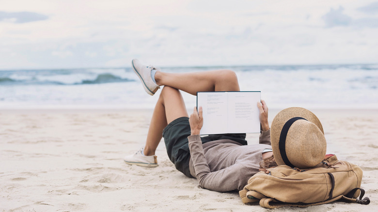 A woman reading on the beach