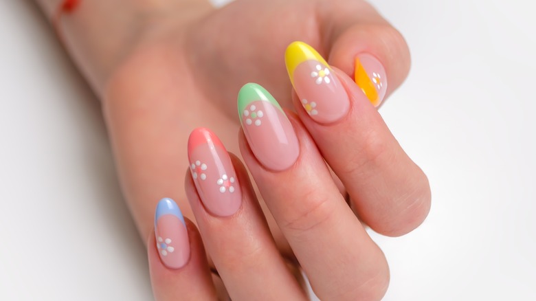 French manicure with colored tips and flowers