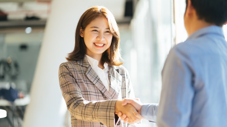 two people shaking hands