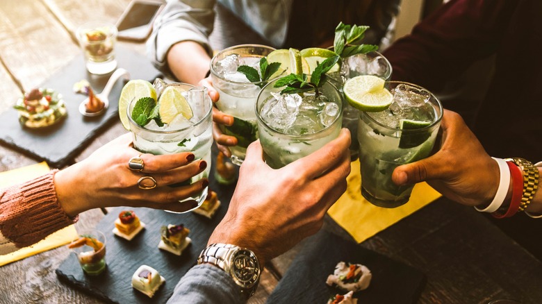 Friends toasting with cocktails