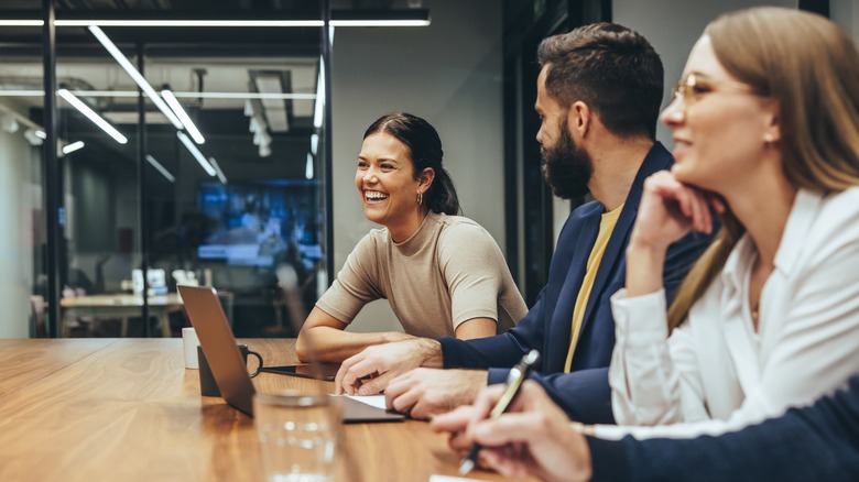 woman smiling in business meeting