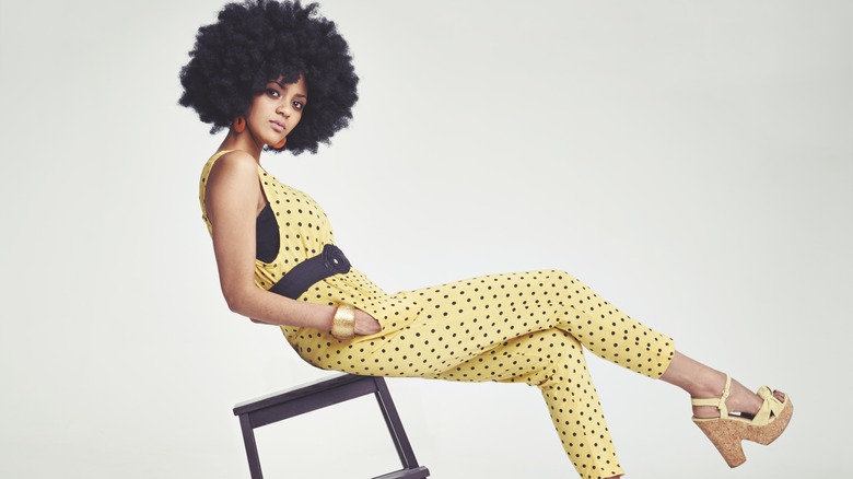 woman wearing a yellow jumpsuit