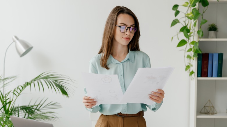 Woman looking at papers