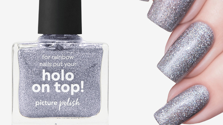 silver sparkle nails next to nail polish bottle