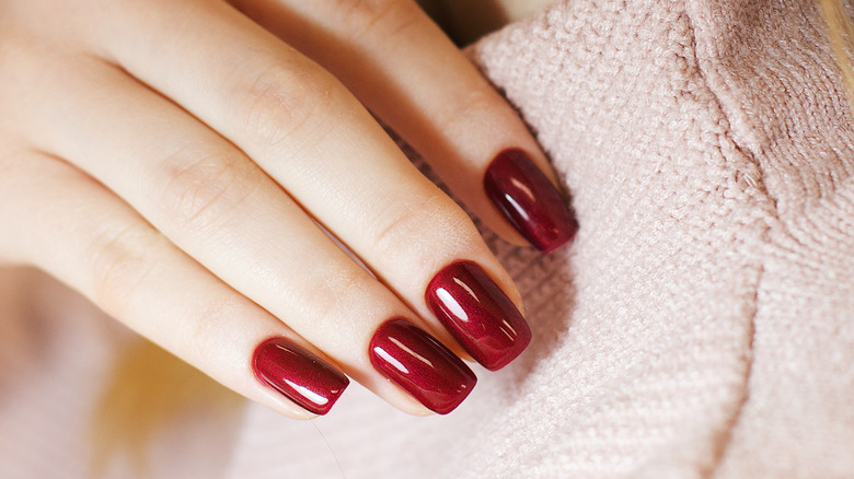 Close up of dark red nails