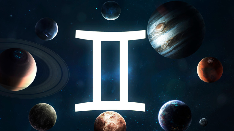 Gemini symbol surrounded by many planets