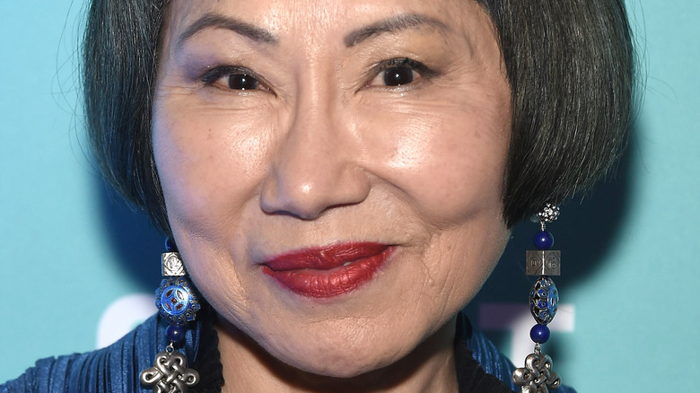 Amy Tan smiling on the red carpet 