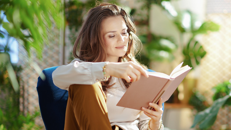 A woman reading a book. 