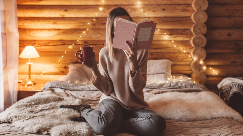 girl reading inside 