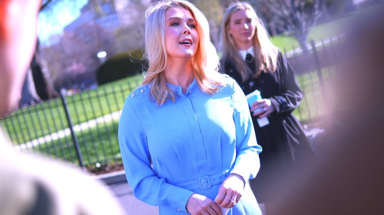 Karoline Leavitt picture outside The White House wearing a light blue coat