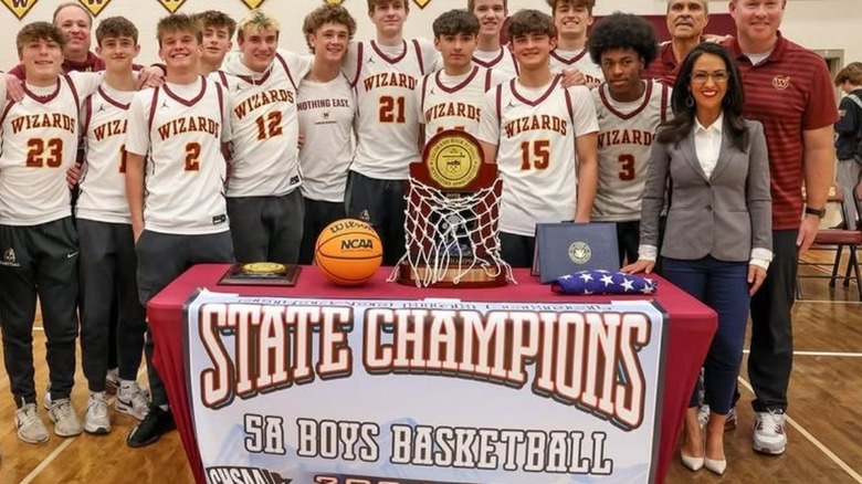 US Congresswoman Lauren Boebert poses for a photo with a boys' basketball team