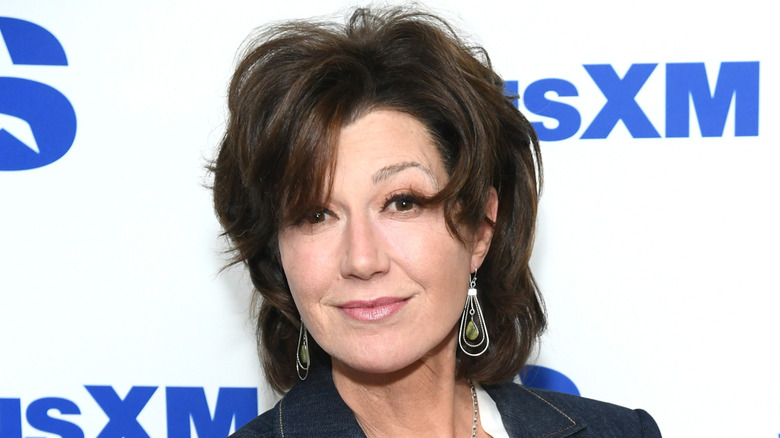 Amy Grant on the red carpet with a SiriusXM ad in the background