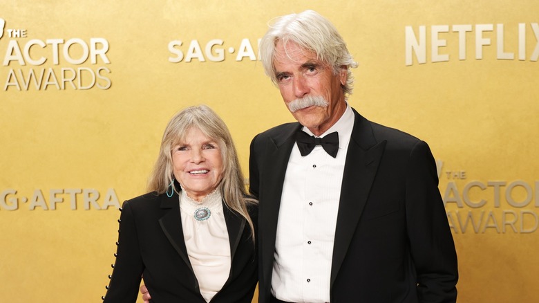 Katharine Ross and Sam Elliott in matching black formal suits