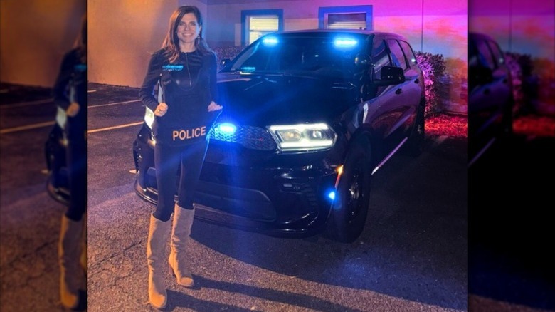 Nancy Mace poses in a police vest and giant boots (2025)