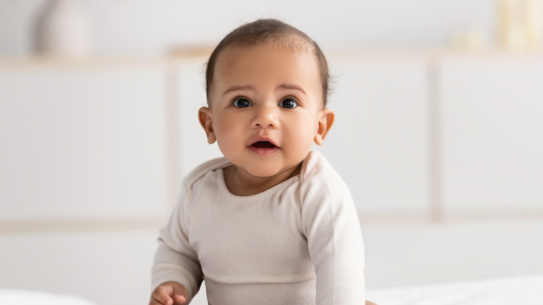 Baby boy of color smiling