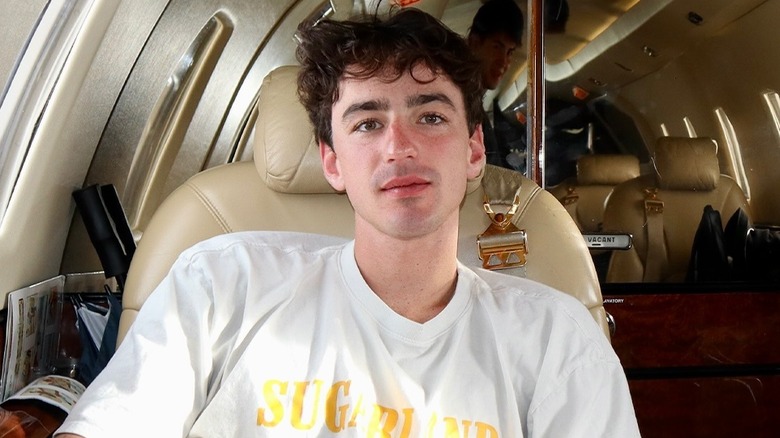 Ben Bader sitting on a private plane.
