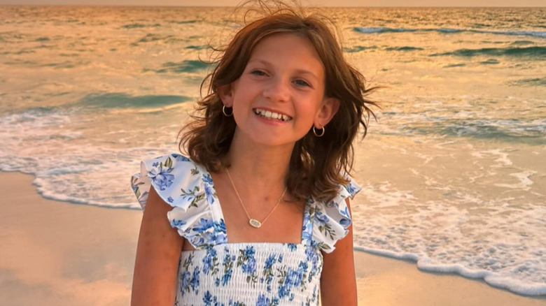 Zuza Beine is smiling while at the beach.