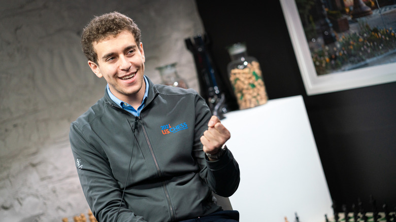Daniel Naroditsky in a "2021 US Chess" jacket smiling