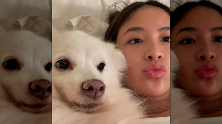Emman Atienza posing in a selfie with a dog