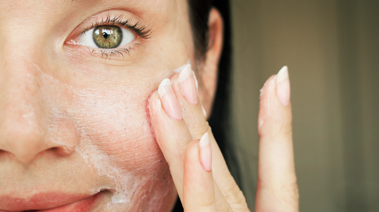 woman washing her face