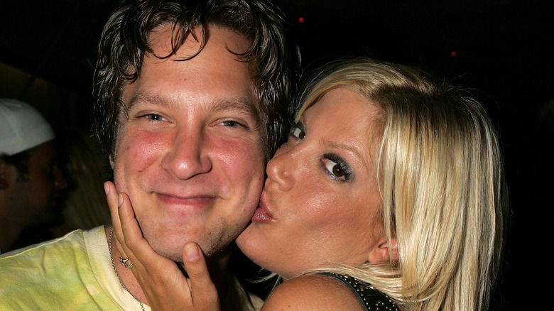 Randy Spelling gets kissed on cheek by Tori Spelling