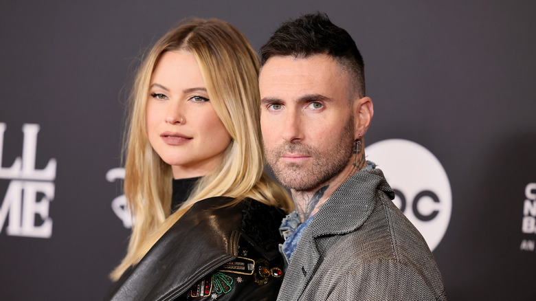 Behati Prinsloo and Adam Levine posing