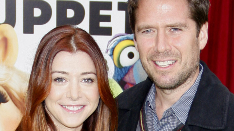 Alyson Hannigan and Alexis Denisof posing