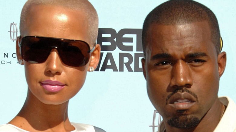 Amber Rose and Kanye West pose on red carpet