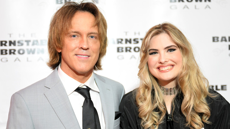 Larry and Dannielynn Birkhead smiling while posing at an event together