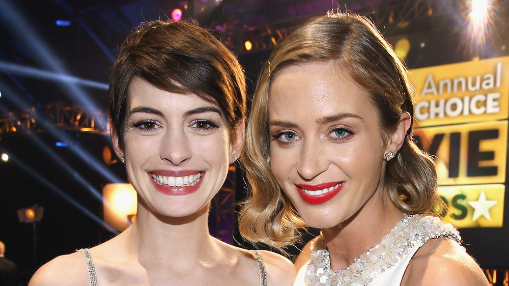 Anne Hathaway and Emily Blunt at an awards ceremony