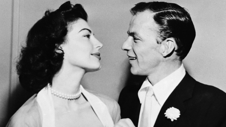 Ava Gardner and Frank Sinatra smiling  at each other