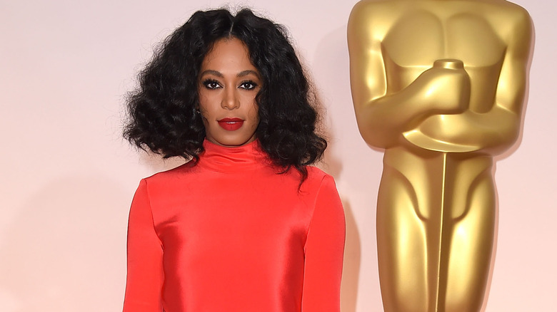 Solange Knowles wearing red dress