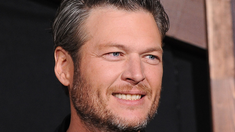 Blake Shelton smiling at an event