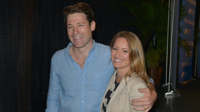 Tony Dokoupil places his arm around Katy Tur as they both laugh while attending The Miami Book Fair at Miami Dade College Wolfson in 2017.