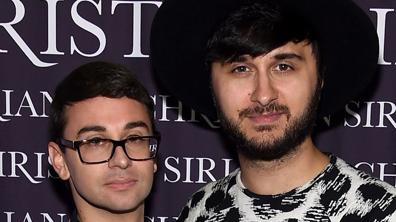 Christian Siriano and Brad Walsh posing together at an event