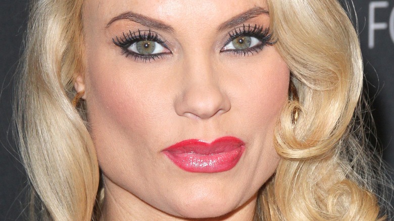 close up of Coco Austin wearing red lipstick