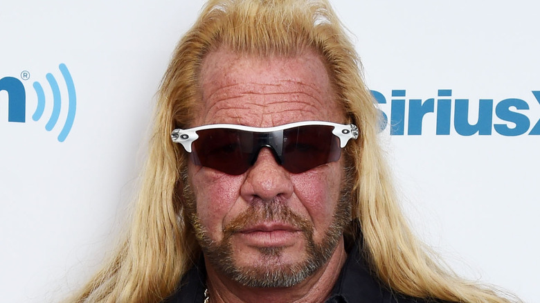 Dog the Bounty Hunter poses on the red carpet