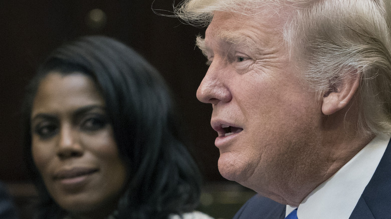Omarosa and Donald Trump seated at table