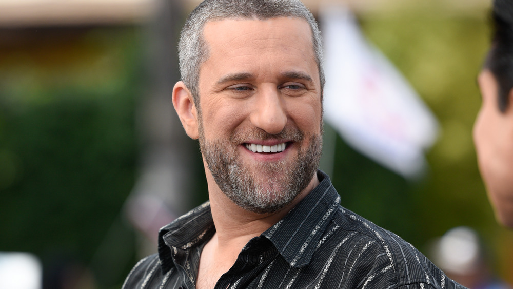 Gray-haired Dustin Diamond smiling 