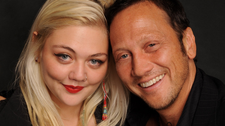 Elle King posing with her father Rob Schneider