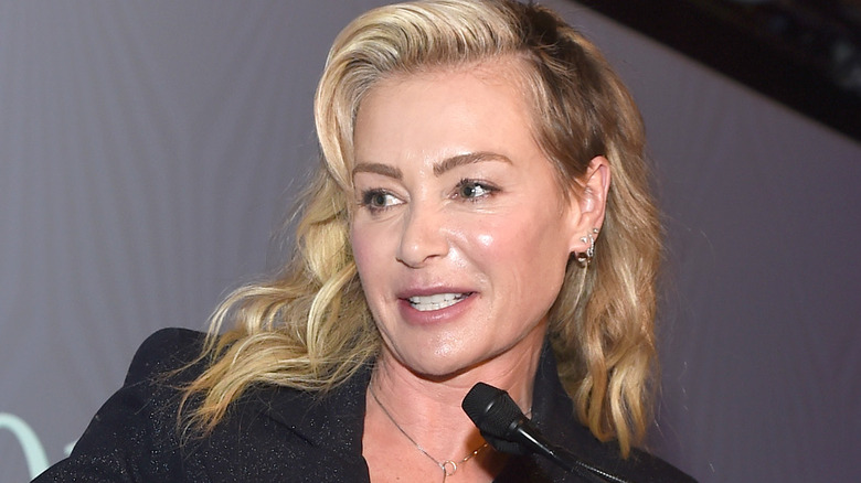Portia de Rossi speaking into a microphone