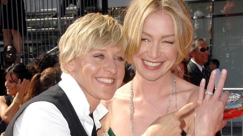 Ellen DeGeneres pointing to Portia de Rossi's ring