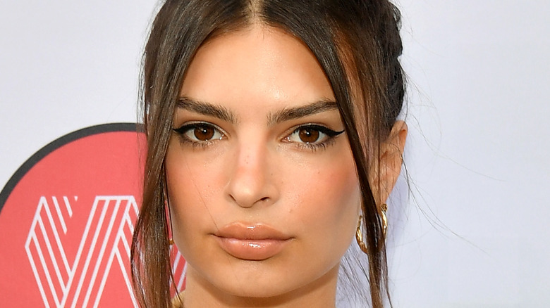 Emily Ratajkowski poses on the red carpet