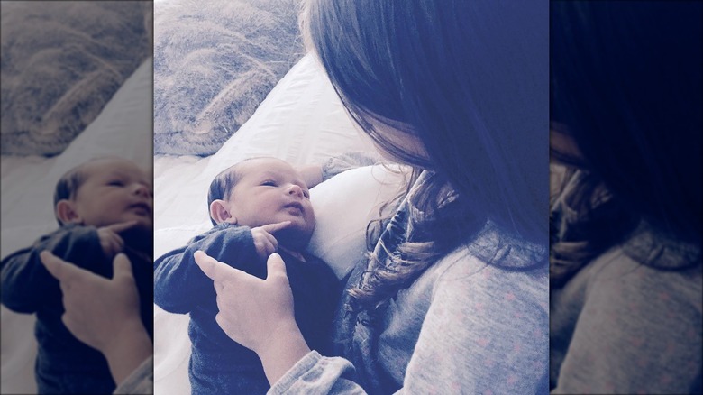 Talia Fiore holding her newborn brother