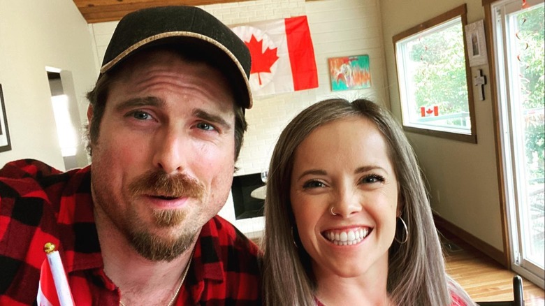 Marcus Rosner and Ali Kroeker holding a flag of Canada