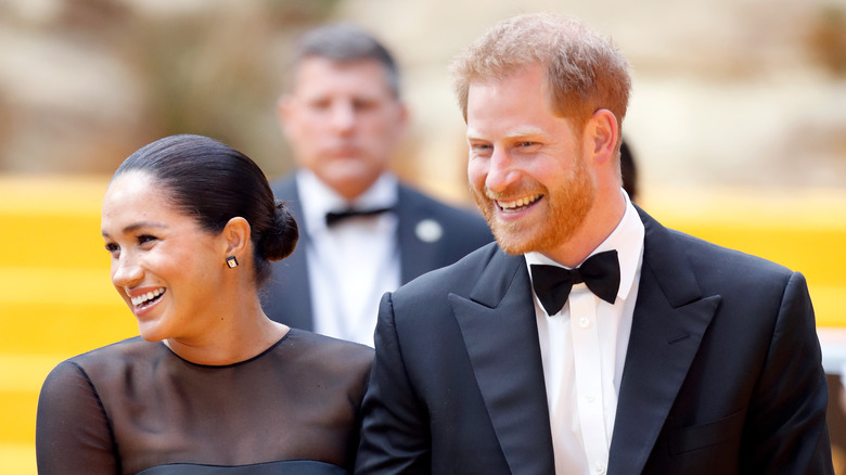 Meghan and Harry smiling