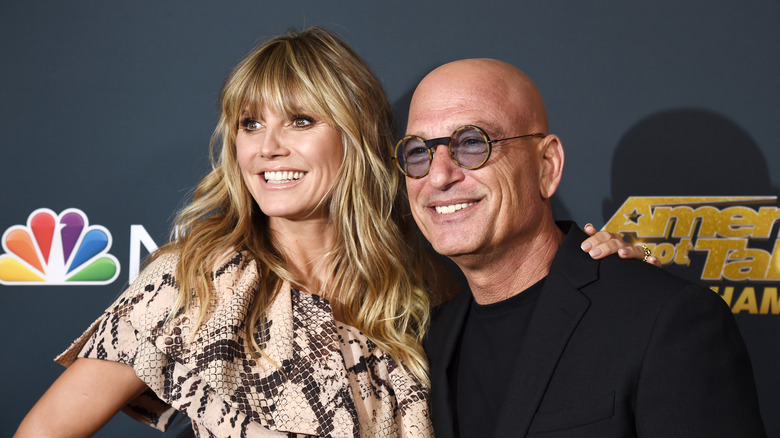 Heidi Klum and Howie Mandel smile during AGT premiere