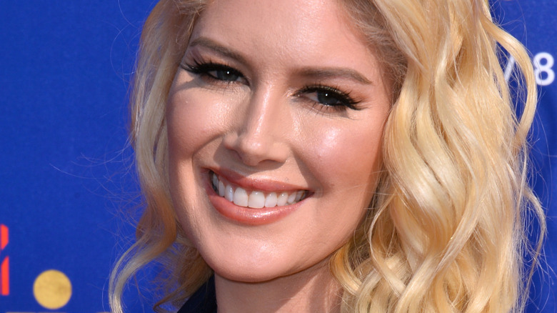 Heidi Montag with wide smile at an event