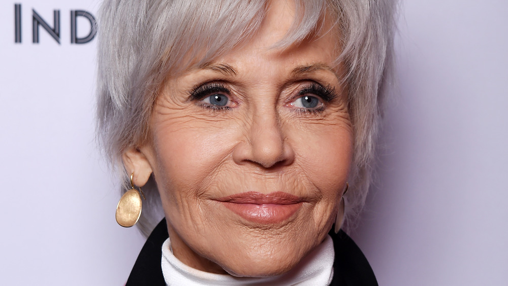 Jane Fonda grinning with short grey hair